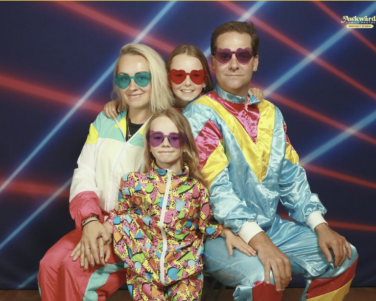 Awkward family photo with matching outfits and forced smiles