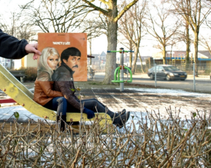 Person holding vinyl sleeve lined up to their body in a sleeveface photo