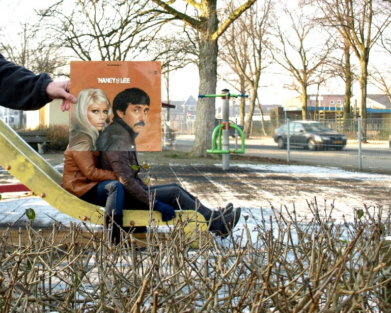 Person holding vinyl sleeve lined up to their body in a sleeveface photo